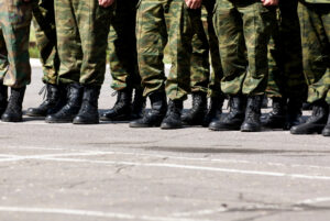 Military soldiers boots on the ground.