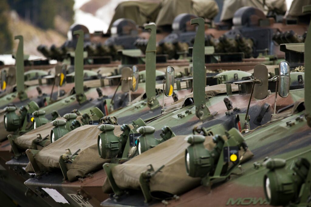 Military vehicles stationed next to each other.
