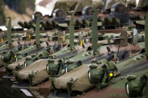 Military vehicles stationed next to each other.